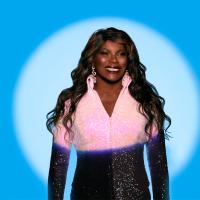 Marcia Hines with beam of light on her